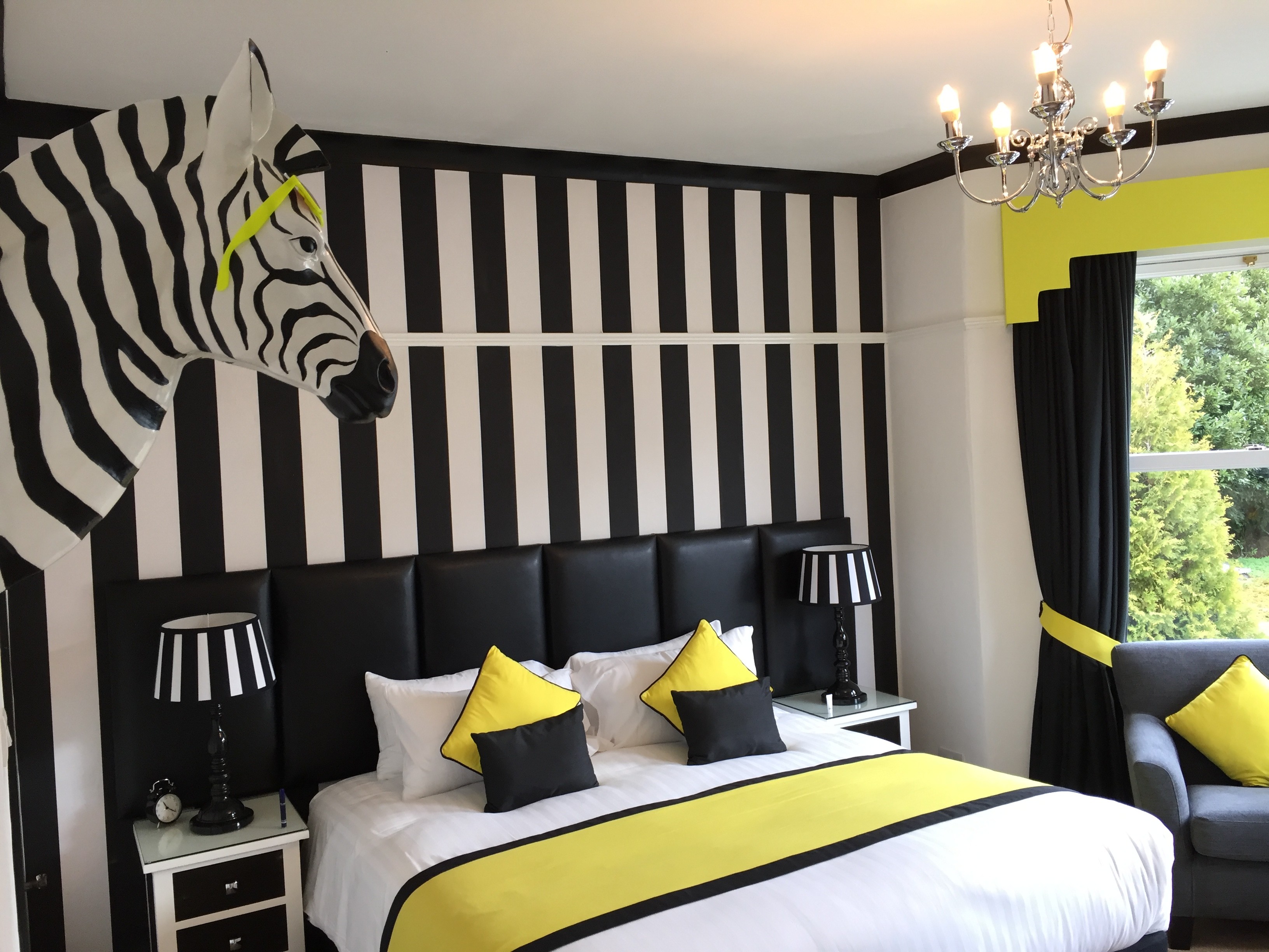 Main bedroom with chic styling in boutique accommodation