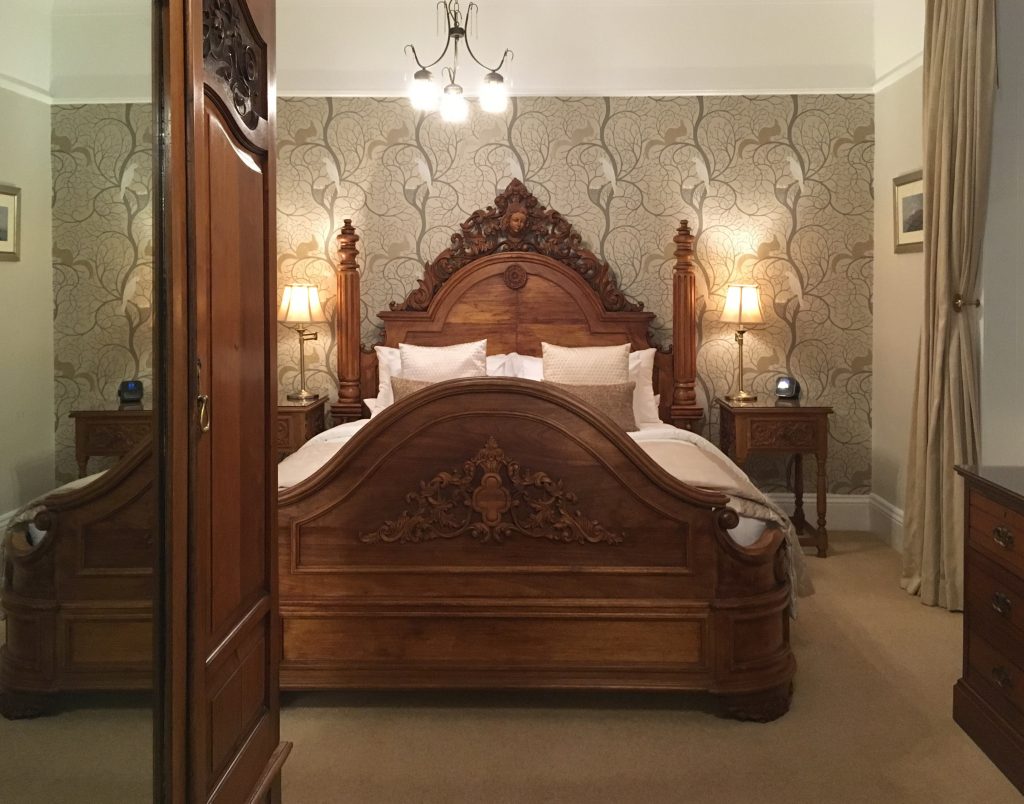 Period style bed in luxury bedroom